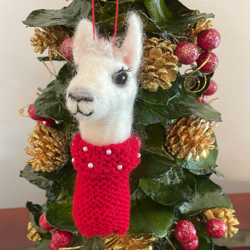 Hand crafted artisan needle felted llama in a knit turtleneck adorned in pearls